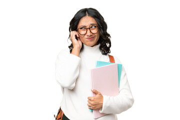 Young Argentinian student woman over isolated background frustrated and covering ears