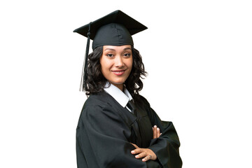 Young university graduate Argentinian woman over isolated background with arms crossed and looking...