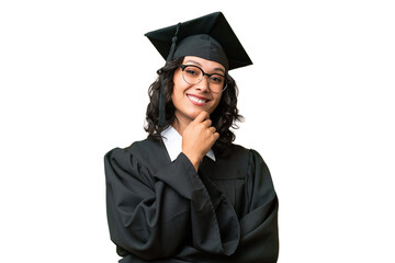 Young university graduate Argentinian woman over isolated background with glasses and smiling
