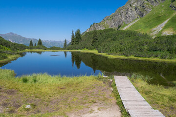 Mountain lake Wiegensee in Gaschurn, Montafon Valley, Vorarlberg, Austria; this lake is distinguished as the most beautiful lake of Austria