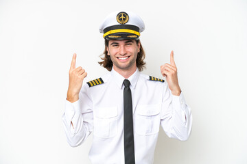 handsome Airplane pilot isolated on white background pointing up a great idea