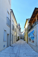 Fototapeta na wymiar A narrow street of Campomarino, a painted village of Molise in Italy.
