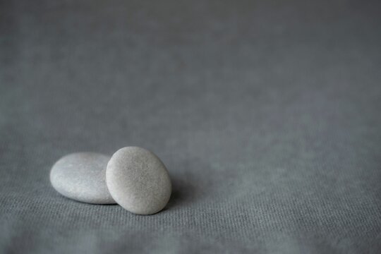 Closeup shot of two gray stones on an isolated background perfect as a wallpaper