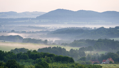 view on misty hills in Kaczawskie mountains in Poland