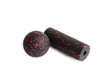 Massage set: A black red ball and mfr massage mini roller isolated on a white background. Close-up....