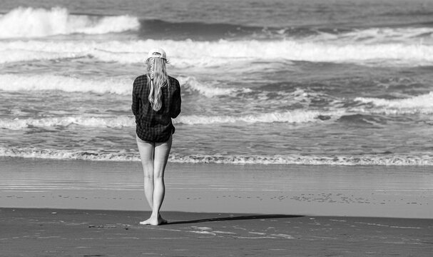 person walking on the beach