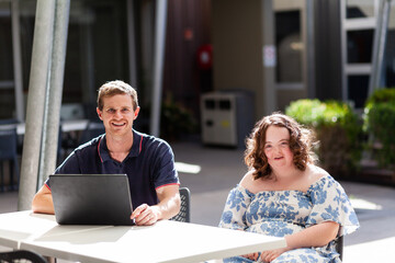 Portrait of NDIS provider disability worker and young teen client with down syndrome