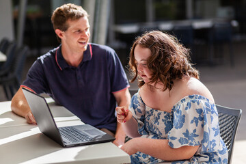 Young person with a disability learning to talk with hands in AUSLAN australian sign language
