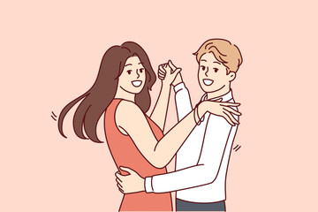 Man and women dancing bachata or salsa wish to become professional latin dancers and embracing partner looking at camera. Happy couple of guys and girls dancing to music in club or on dance floor 