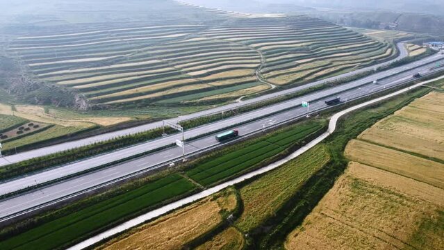 Aerial shot over beautiful highways and green landscapes