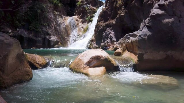 Cascada de Comala Park with green vegetation around on a sunny day in Chiquilistlan, Mexico