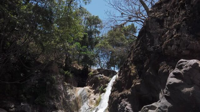 Cascada de Comala Park with green vegetation around on a sunny day in Chiquilistlan, Mexico