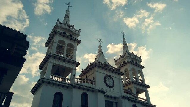 Low angle time lapse footage of Parroquia de San Cristobal Catholic church in Mazamitla, Mexico