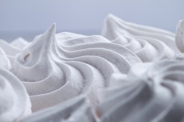 Closeup shot of meringue on white background.