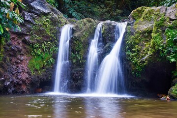 Fototapeta na wymiar Beautiful long-exposure view of waterfalls in Sao Miguel Island