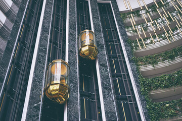 Design and architecture. Glasses elevators in the hotel's hall. © Loginova