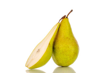 One whole and one half ripe organic pear, macro, on white background.