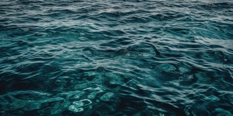 Obraz premium Blue sea water texture with white foam top view - generative ai