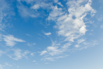 Fototapeta premium Blue sky background with white clouds