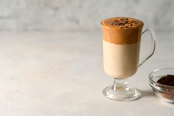 Dalgona coffee. Iced whipped coffee and milk. Copy space.