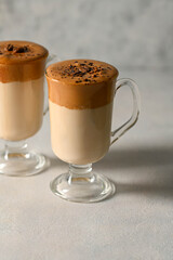 Dalgona coffee. Iced whipped coffee and milk. Refreshing coffee drink in glass cups.