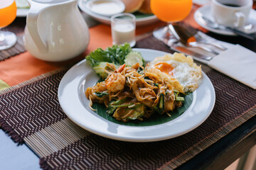 Famous Thai food on the wooden table for the breakfast