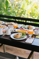 Thai food, breakfast with American food, khao Phad on old wooden table