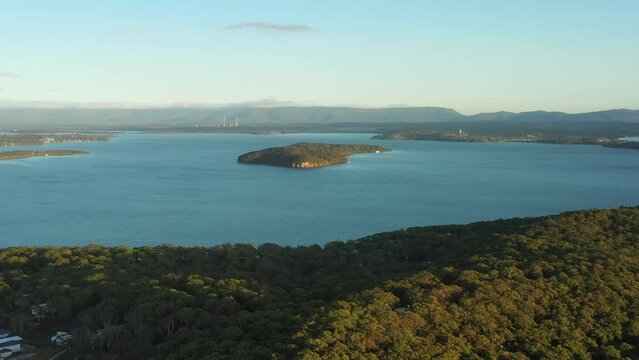 Lake Macquarie national park woods to Pulbah island &ndash; aerial 4k landscape.
