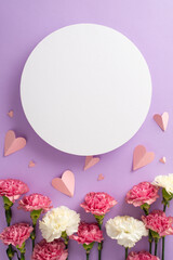 Mother's Day festivities concept. Top vertical view flat lay of beautiful pink paper hearts, and carnation flowers on a soft pastel violet background with circle for text or advert