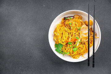 noodles chicken meat, vegetable meal food snack on the table copy space food background rustic top view