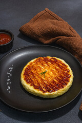 Grilled Halloumi cheese served on plate. Cutlery, traditional food for picnic or BBQ