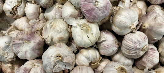 Garlic on display in a market stall,close-up.