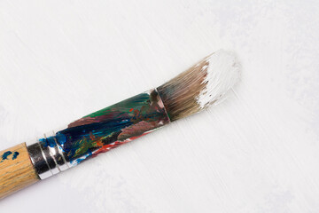 Obraz premium Used paint brush in white color