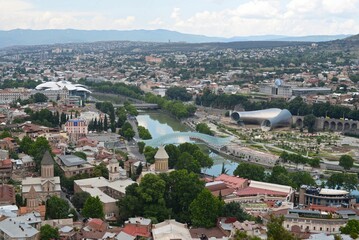 Fototapeta na wymiar Aerial view of Tsiblisi, the capitol of Georgia, here seen with the Kura river