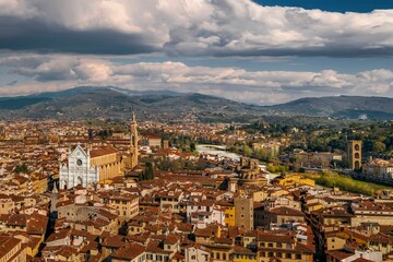 Fototapeta na wymiar Aerial view of cityscape surrounded by buildings in Florence