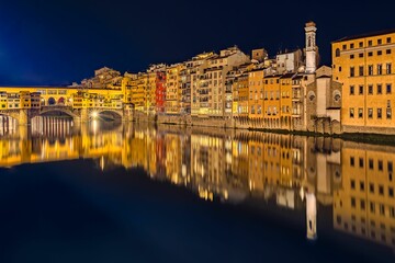 Aerial view of cityscape Florence surrounded by buildings in night