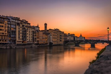 Aerial view of cityscape Florence surrounded by buildings during sunset