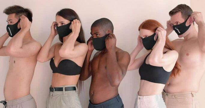careful multi ethnic group of young people wearing masks, looking at camera isolated white background stop coronavirus COVID-19 spreading men women are afraid of illness fear fobia helath body care