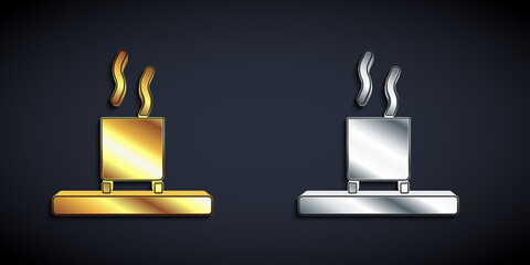 Gold and silver Cup of tea icon isolated on black background. Long shadow style. Vector