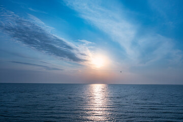 Obraz premium Horizon line, blue sky and blue sea. Drone view