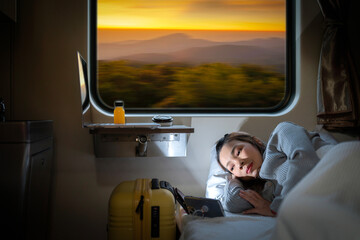 Asian traveller woman sleep and washing TV by her smartphone