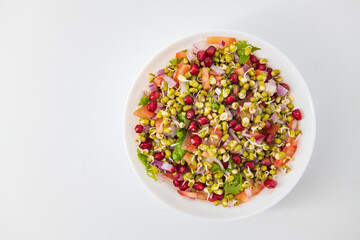 Sprouting green gram bean Indian salad with Onion, coriander leaf , green chilli , Pomegranate and...