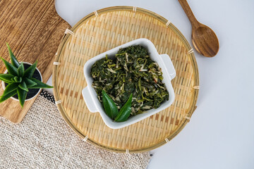 Indian traditional food spinach salad  called Keerti portal or Keerai Thoran in local . Best spinach dish in south india for lunch and dinner. Healthy siru Keerai poriyal isolated