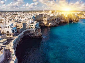 Aerial view of Polignano a Mare, a village built on the edge of the sandstone cliffs above the...