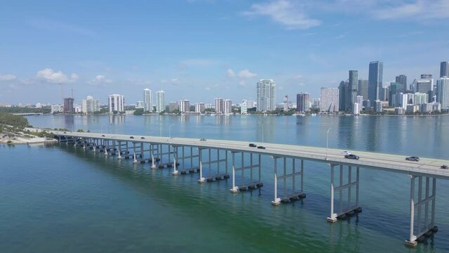 flying clockwise view of Biscayne Bridge revealing Miami skyline
