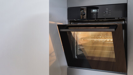 new built in oven with control panel at contemporary apartment