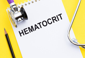 note with text Hematocrit HCT on table in doctor office