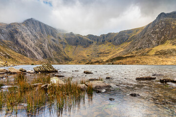 Llyn Idwal is a small lake that lies within Cwm Idwal in the Glyderau mountains of Snowdonia, North Wales, UK.