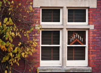 Closeup of a window on a red-bricked wall