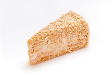 a Triangle piece of honey cake on a white background
